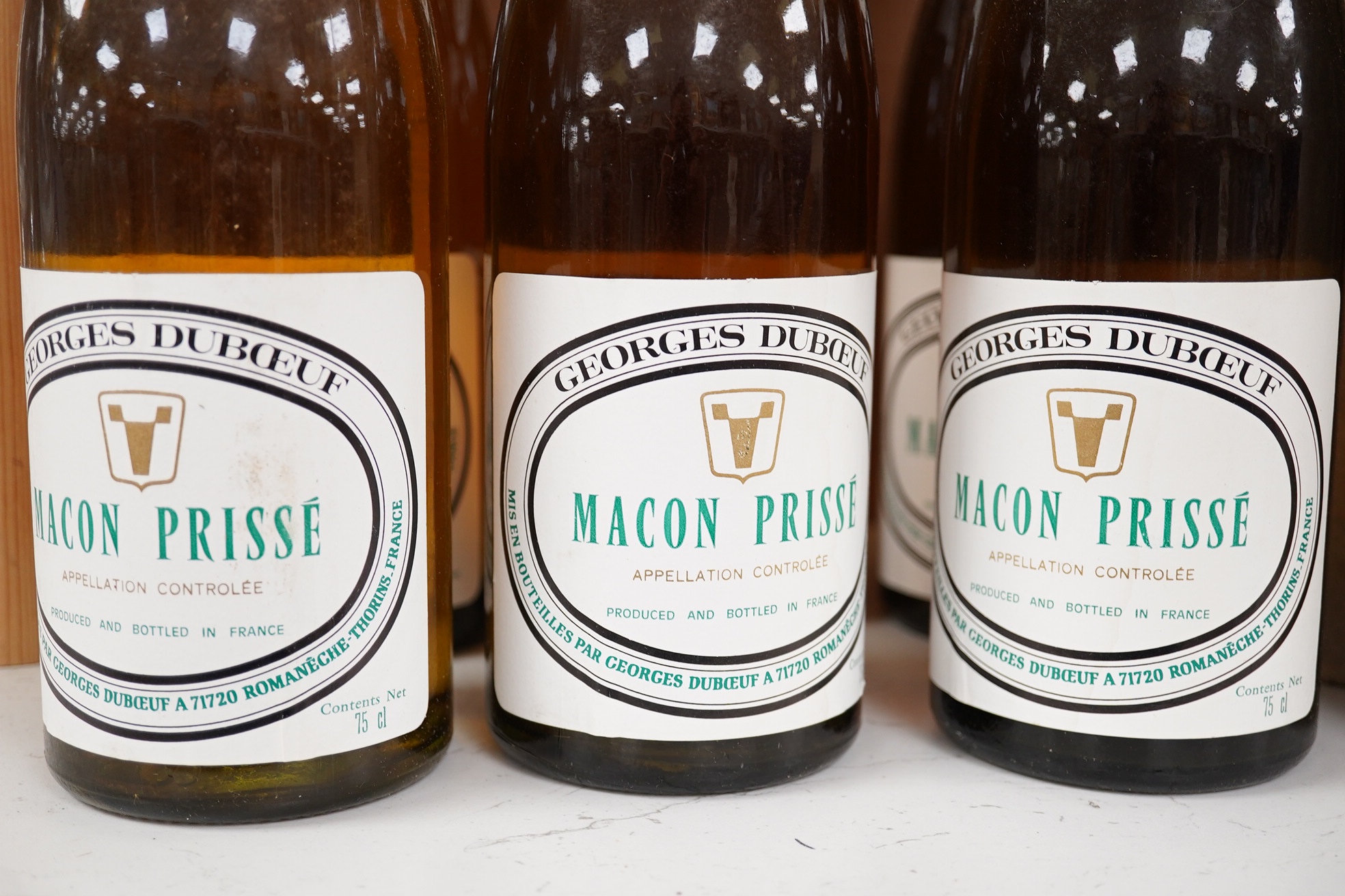 Twelve bottles of wine; six bottles of 1959 Chateau de Ville-George Grand Cru Exceptionnel and six bottles of Georges Duboeuf Macon Prisse 1977. Condition - fair to good